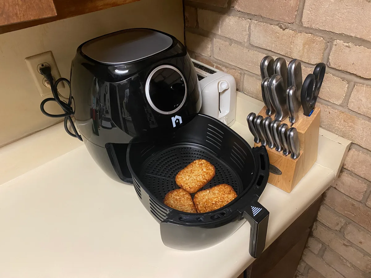 Basket-style air fryer with its drawer open